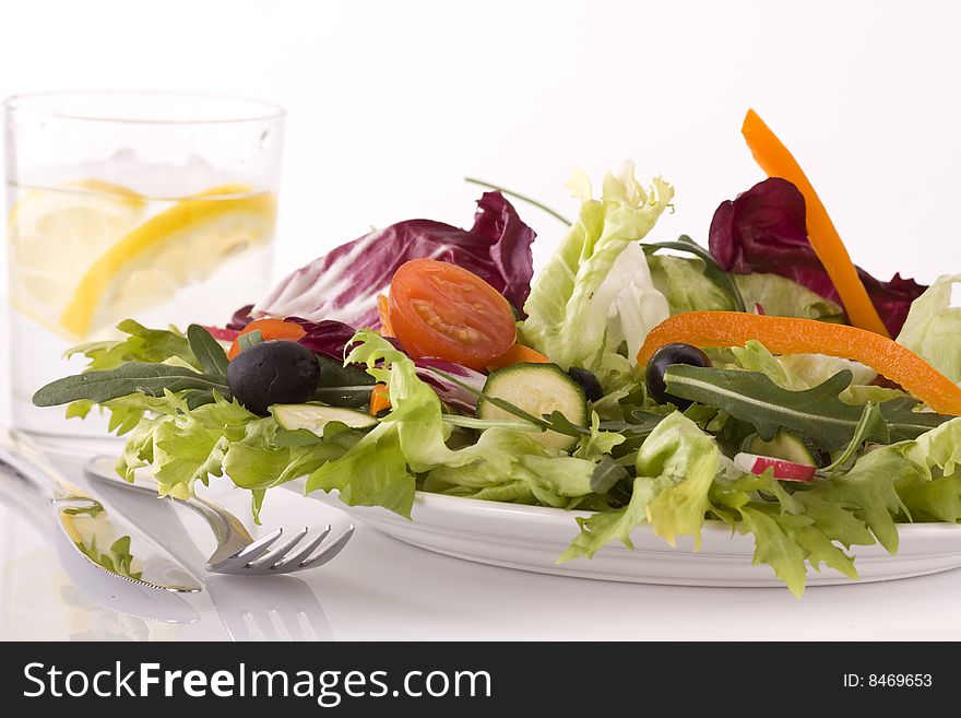Fresh salad on Plate over white background
