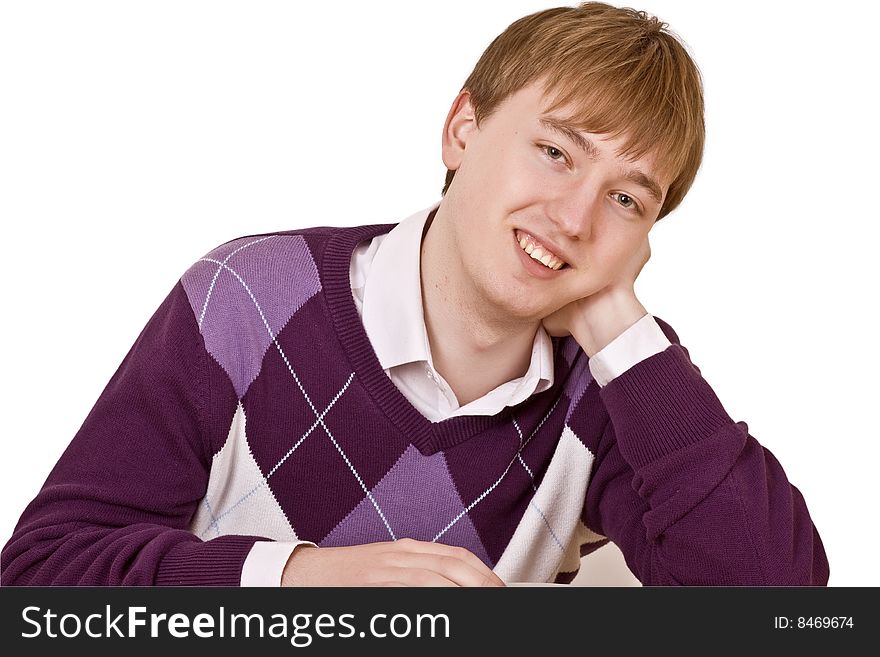 Portrait of a smiling young man sitting, isolated on white background