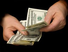 Hands Counting Dollars Stock Image