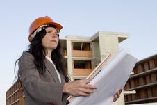 Female Architect Looking At Blueprint Royalty Free Stock Images
