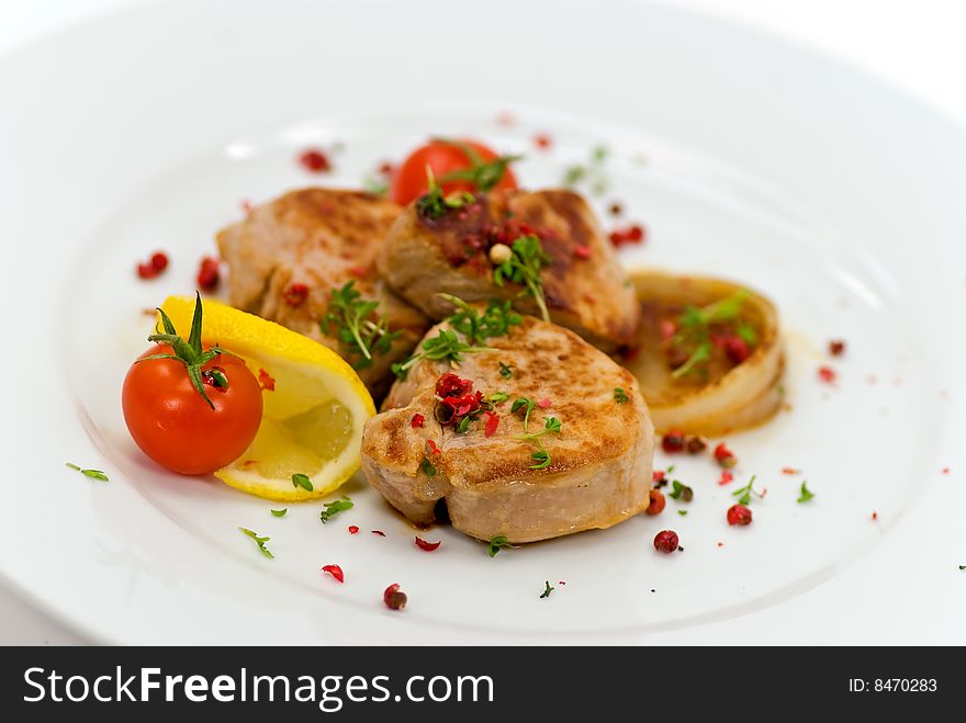 Pork fillet-tenderloin,with baked onion,tomato.