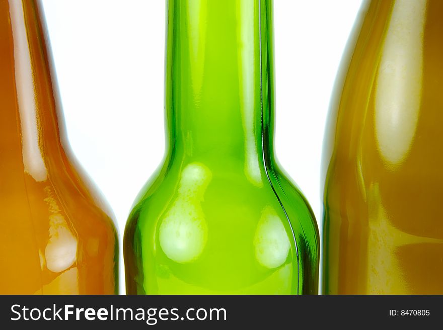 Empty beer bottles isolated against a white background