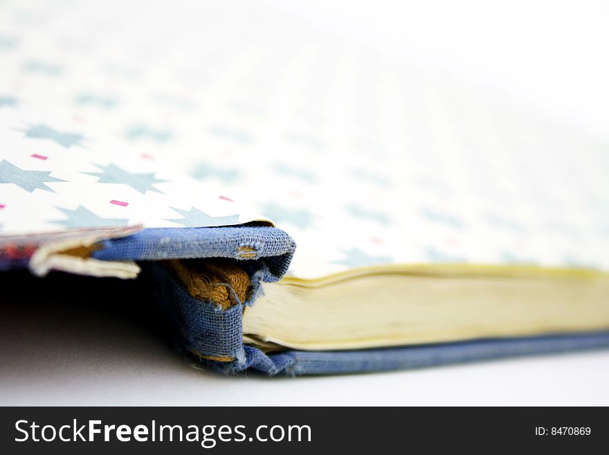 An old opened book isolated on white background