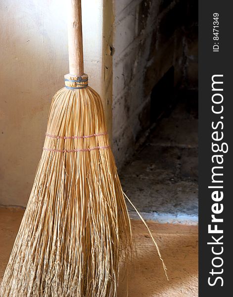 A close-up of an old straw broom. A close-up of an old straw broom