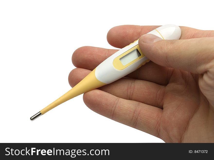 The digital thermometer in a hand on a white background is isolated