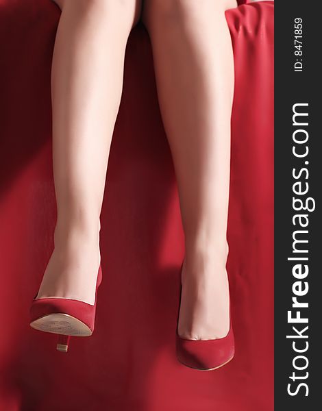 Fine female legs in red shoes. Fine female legs in red shoes