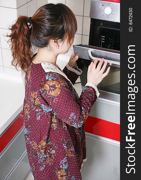 Young asia girl at kitchen