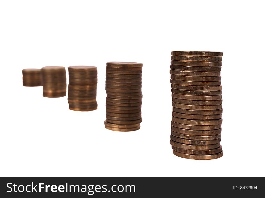 Piles of coins isolated on white background. Piles of coins isolated on white background