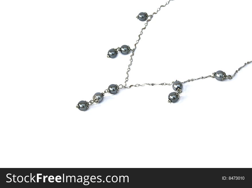 Necklace with gray beads on white background.