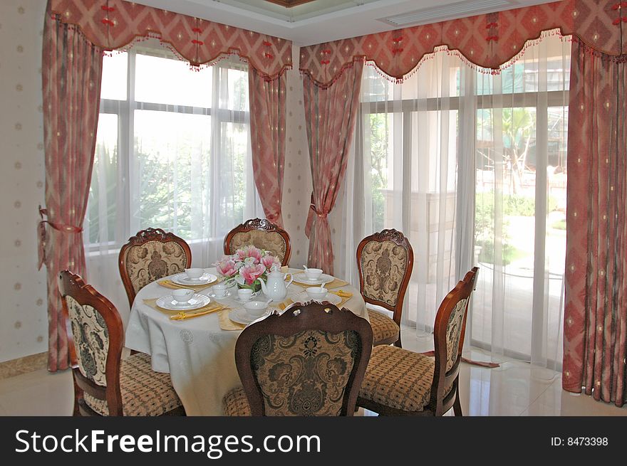 It is interior of apartment, it is the dining room.