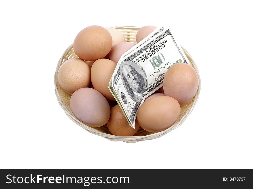 Eggs with dollars in basket.