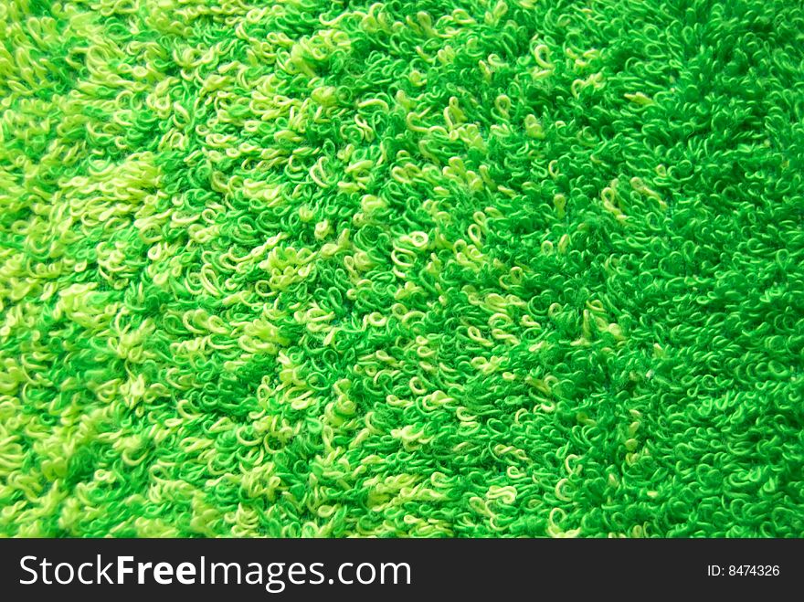 Beautiful background from a green towel for a bath.