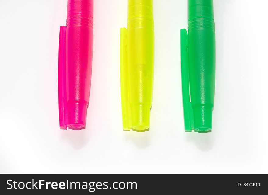 Three highlighter marker pens isolated on white background. Three highlighter marker pens isolated on white background.