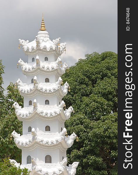 Small buddhist shrine tower in a forest