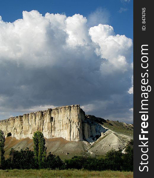 Mountainous landscape. Solitary cliff. Scenic cloud-drift. Mountainous landscape. Solitary cliff. Scenic cloud-drift.