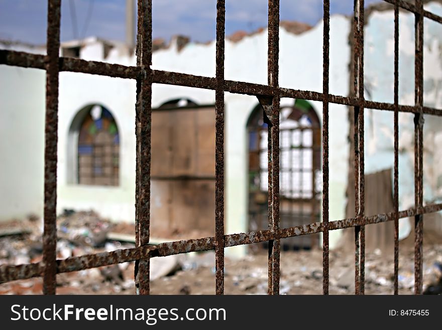 The remains of a house as seen from outside a window. The remains of a house as seen from outside a window