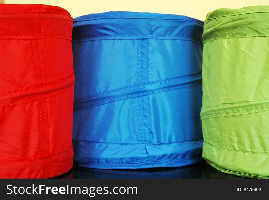 Red, green and blue fabric containers. Red, green and blue fabric containers