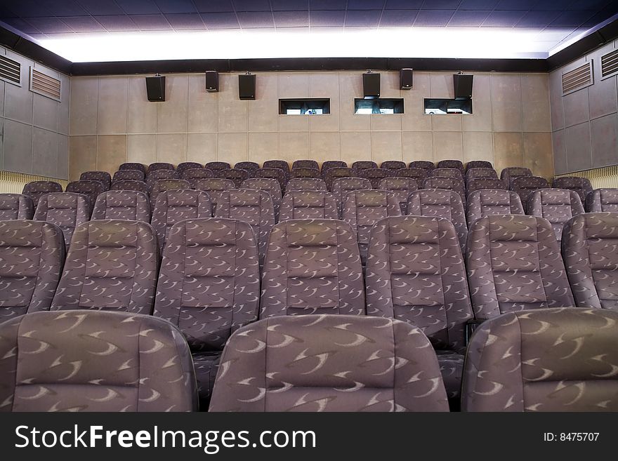 Empty new cinema auditorium with rows of chairs. Empty new cinema auditorium with rows of chairs.