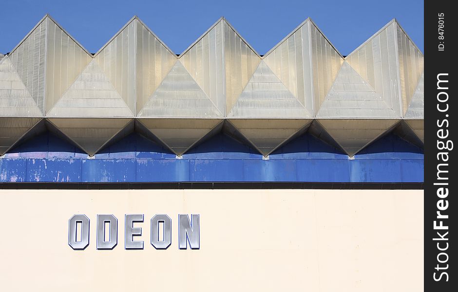 Architectural roof detail of the Odeon Cinema against a blue sky background in Brighton ( Sussex , UK ). Architectural roof detail of the Odeon Cinema against a blue sky background in Brighton ( Sussex , UK )