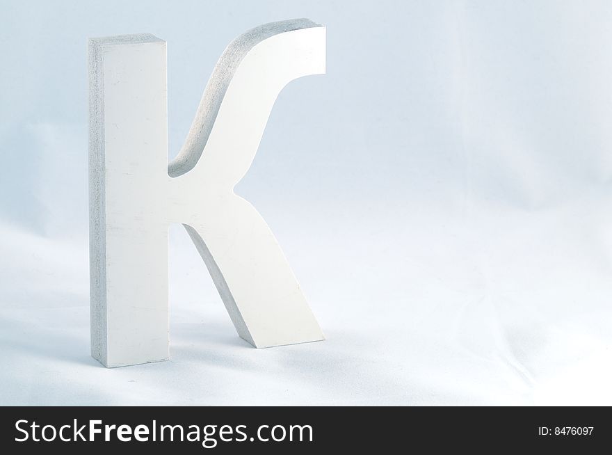 Letter K isolated on blue background