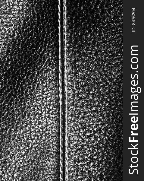 The black genue leather background. The black genue leather background