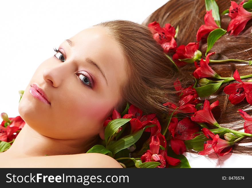 Laying beautiful  young woman with flowers. Laying beautiful  young woman with flowers