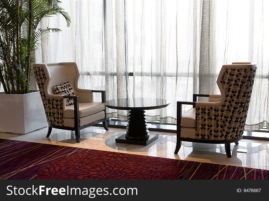 Two modern armchairs in a hotel lobby. Two modern armchairs in a hotel lobby