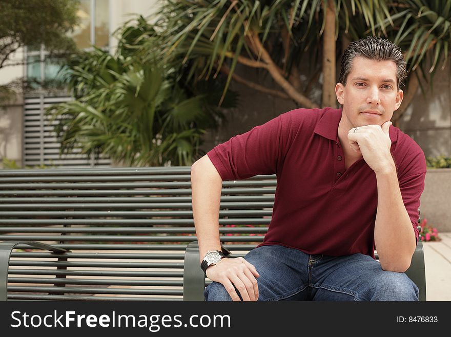 Young businessman on a bench. Young businessman on a bench