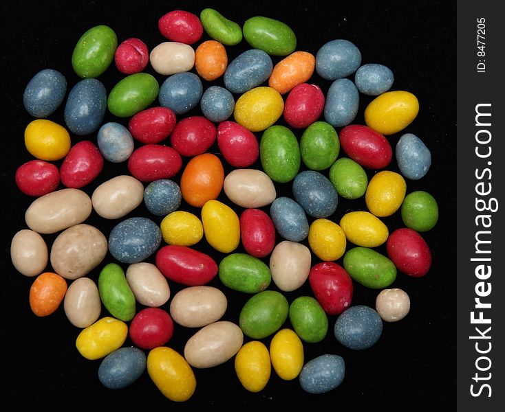 Colorful candies isolated on a black background