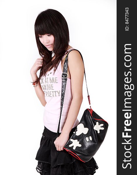 A beautiful Asian girl with handbag on white background.
