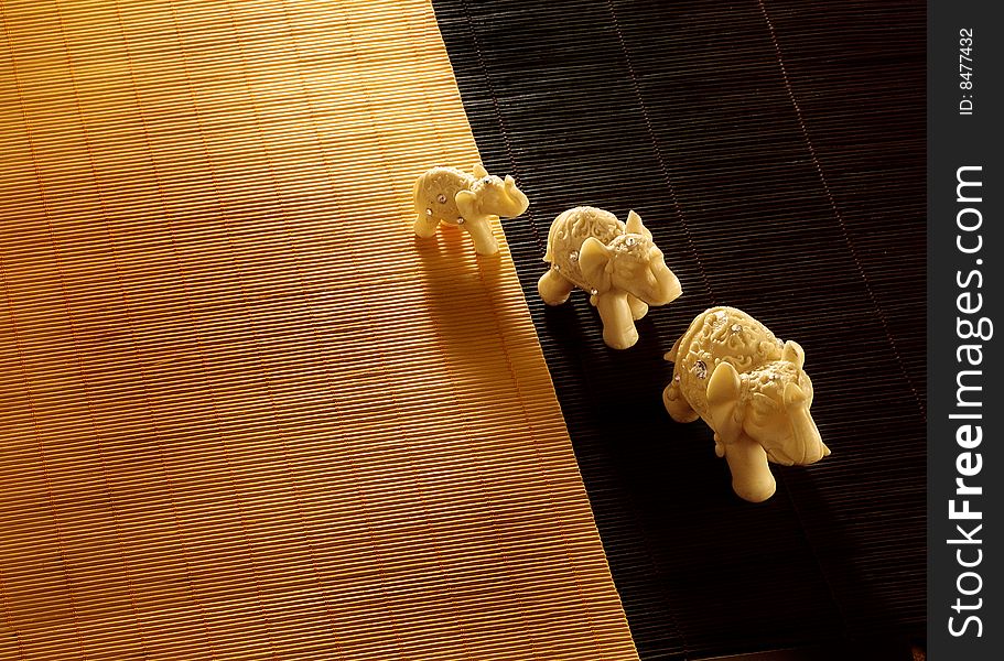 Three Elephant Toys On A Mat
