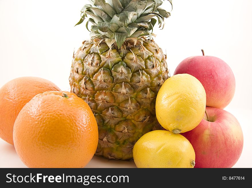 Pinapple, oranges, lemons and apples isolated. Pinapple, oranges, lemons and apples isolated.