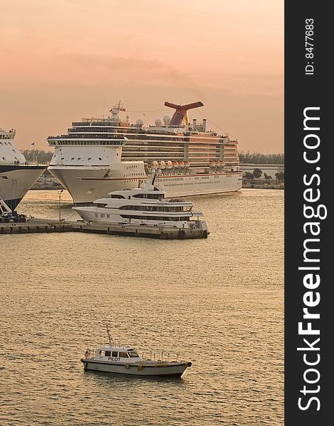 Pilot Boat And Cruise Ships At Dusk