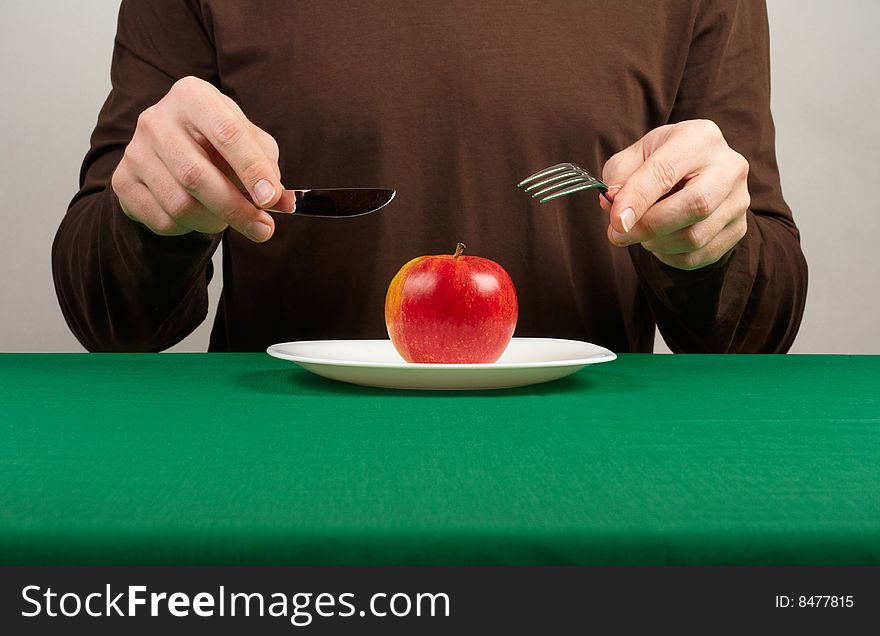 Photo of a man going to eat an apple. Photo of a man going to eat an apple