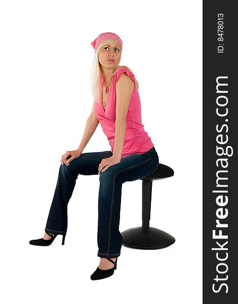 Blonde pink blouse blue jeans on chair