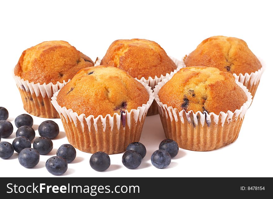 Five fresh blueberry muffins with berries isolated on white background. Five fresh blueberry muffins with berries isolated on white background