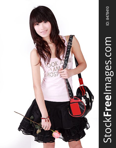 A beautiful Asian girl with handbag on white background. A beautiful Asian girl with handbag on white background.