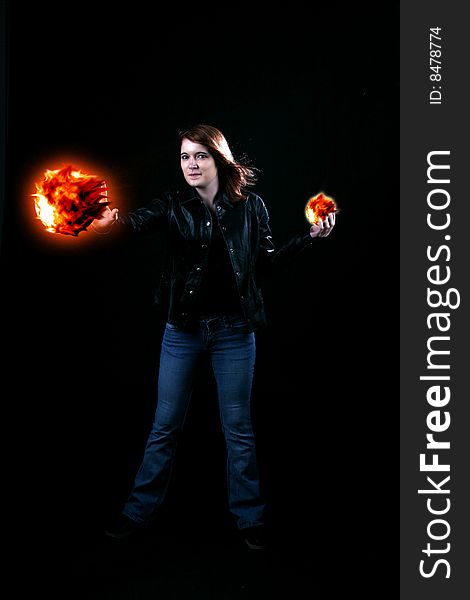 Teenage Girl Holding Fireballs In Her Hands