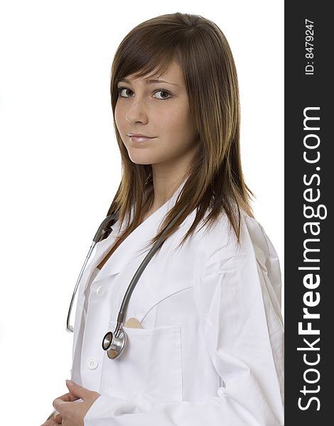 Young woman doctor with stethoscope, in a white coat against a white background