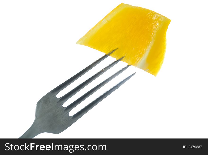 Stock photo: an image of yellow paprika on the fork