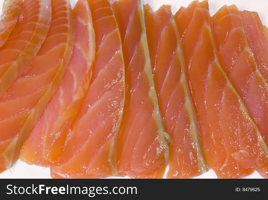 Slices of a salmon, photo close up on a white background.