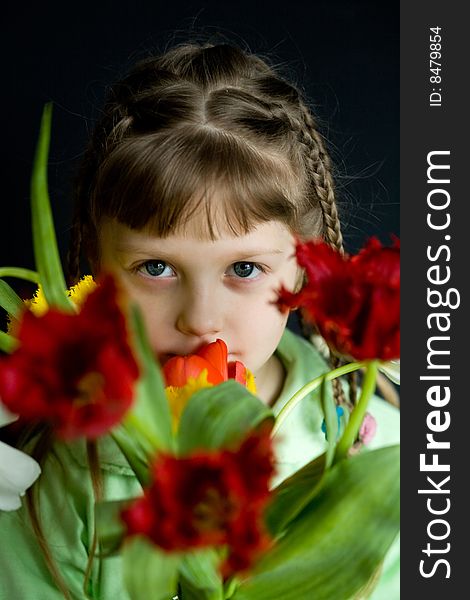 Stock photo: an image of a girl with a bunch of flowers. Stock photo: an image of a girl with a bunch of flowers