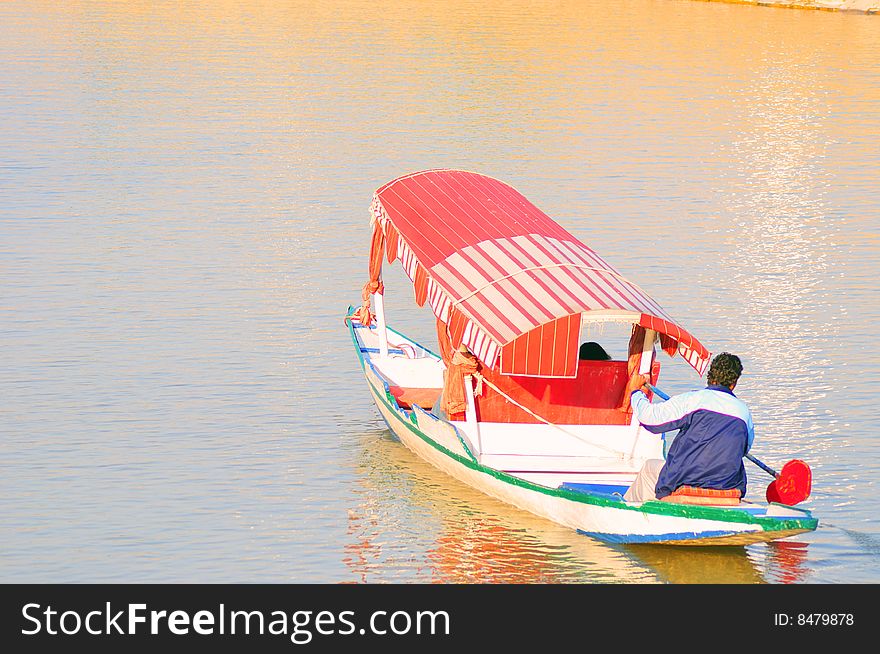Tourist boat in dull lake at kashmir india.