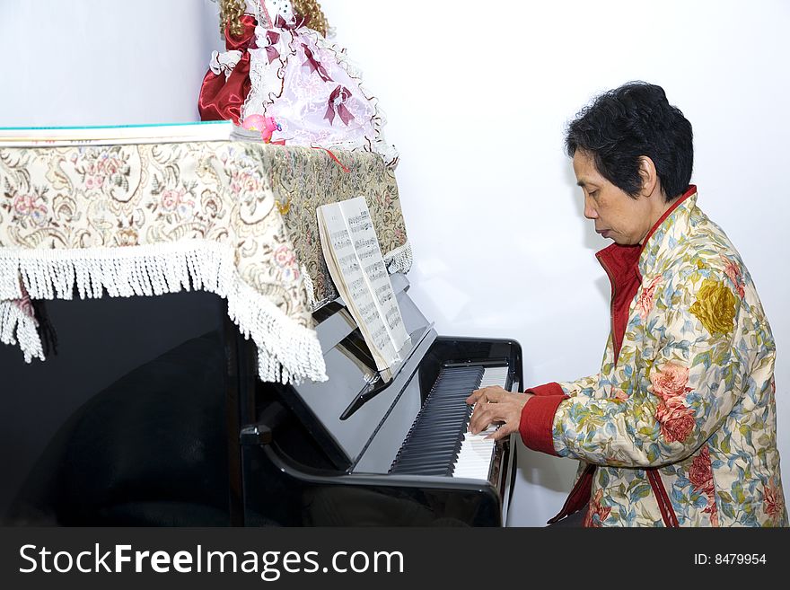 A child is playing piano
