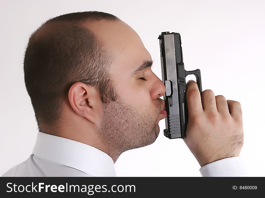 Man Kissing A Gun