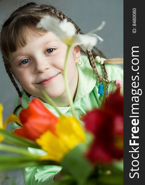 Stock photo: an image of a happy girl with tulips