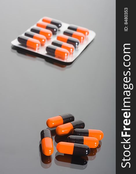 Macro of pills on glass background
