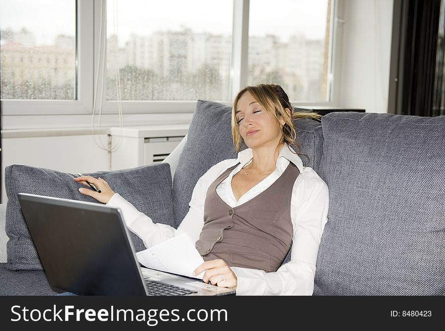 Beautiful businesswoman working at home