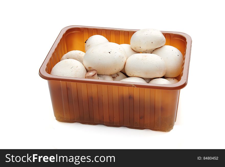 Shot of mushrooms in a box on white