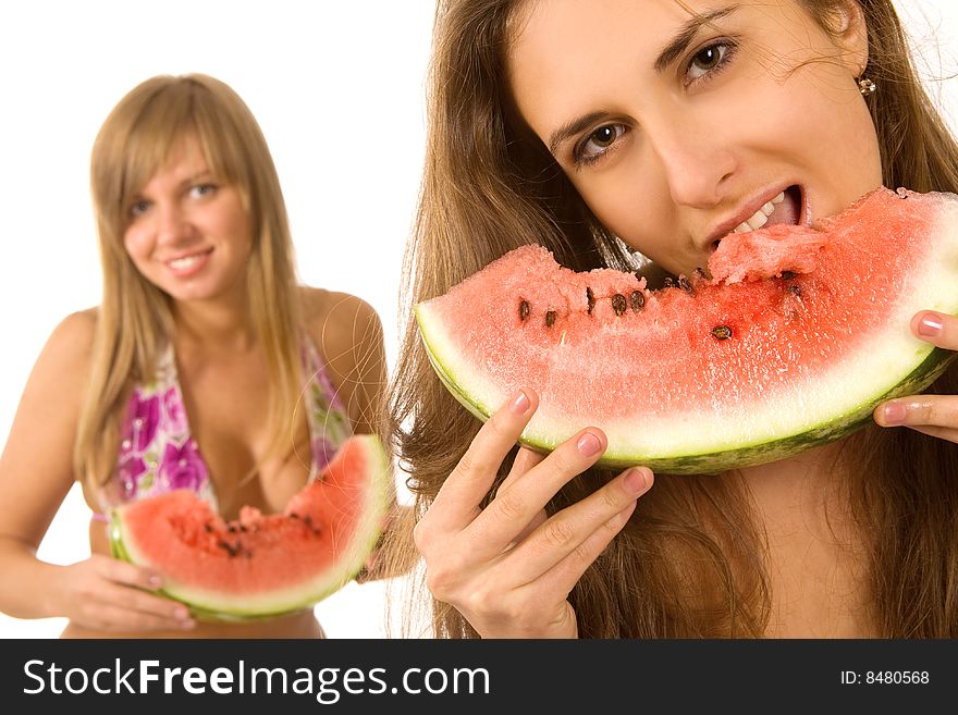 girls in bikini eating watermelon. girls in bikini eating watermelon